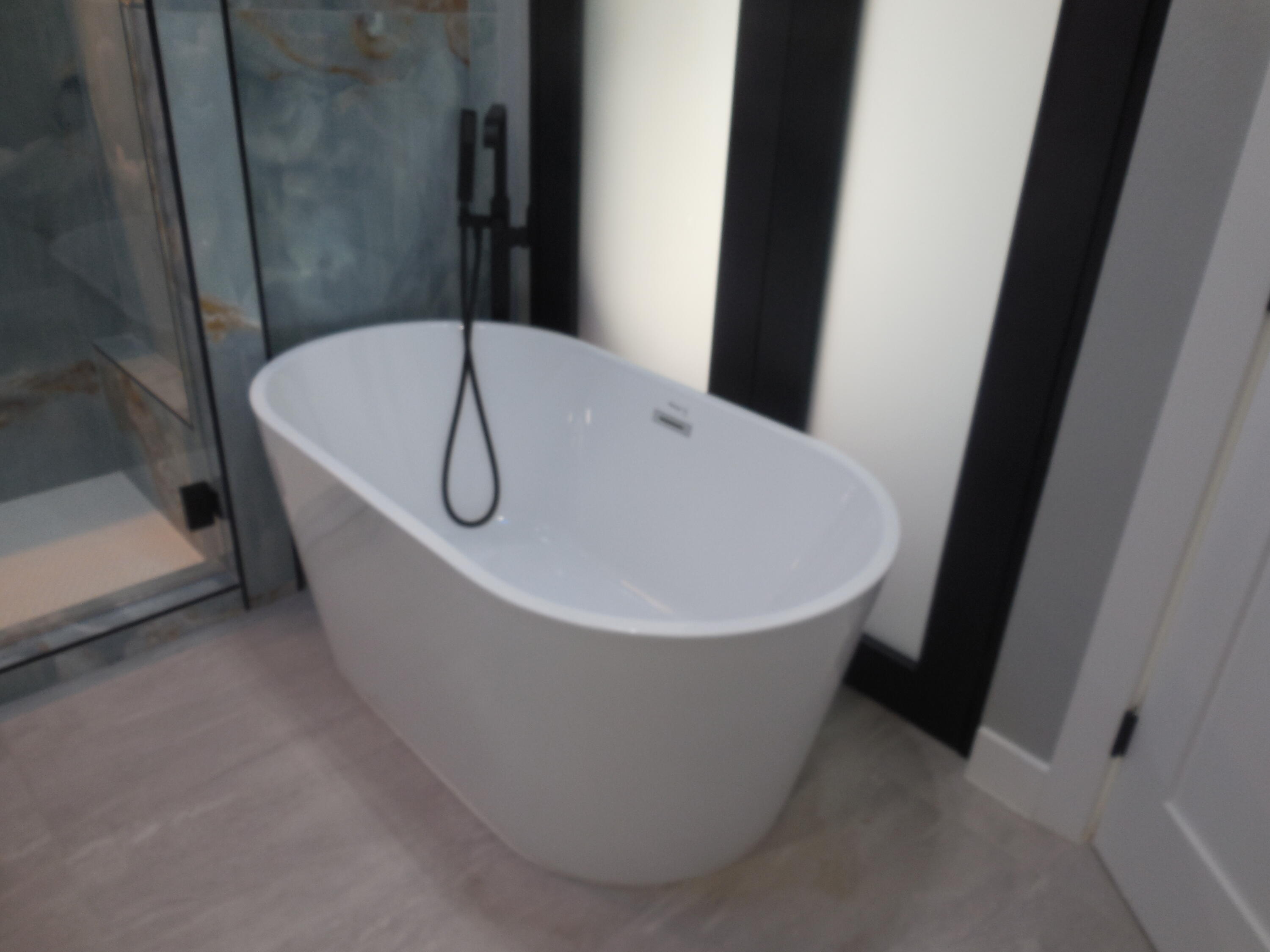 83389 Calypso Circle Indio, CA 92201 - Photo 20 of 45 a white bath tub sitting in a bathroom