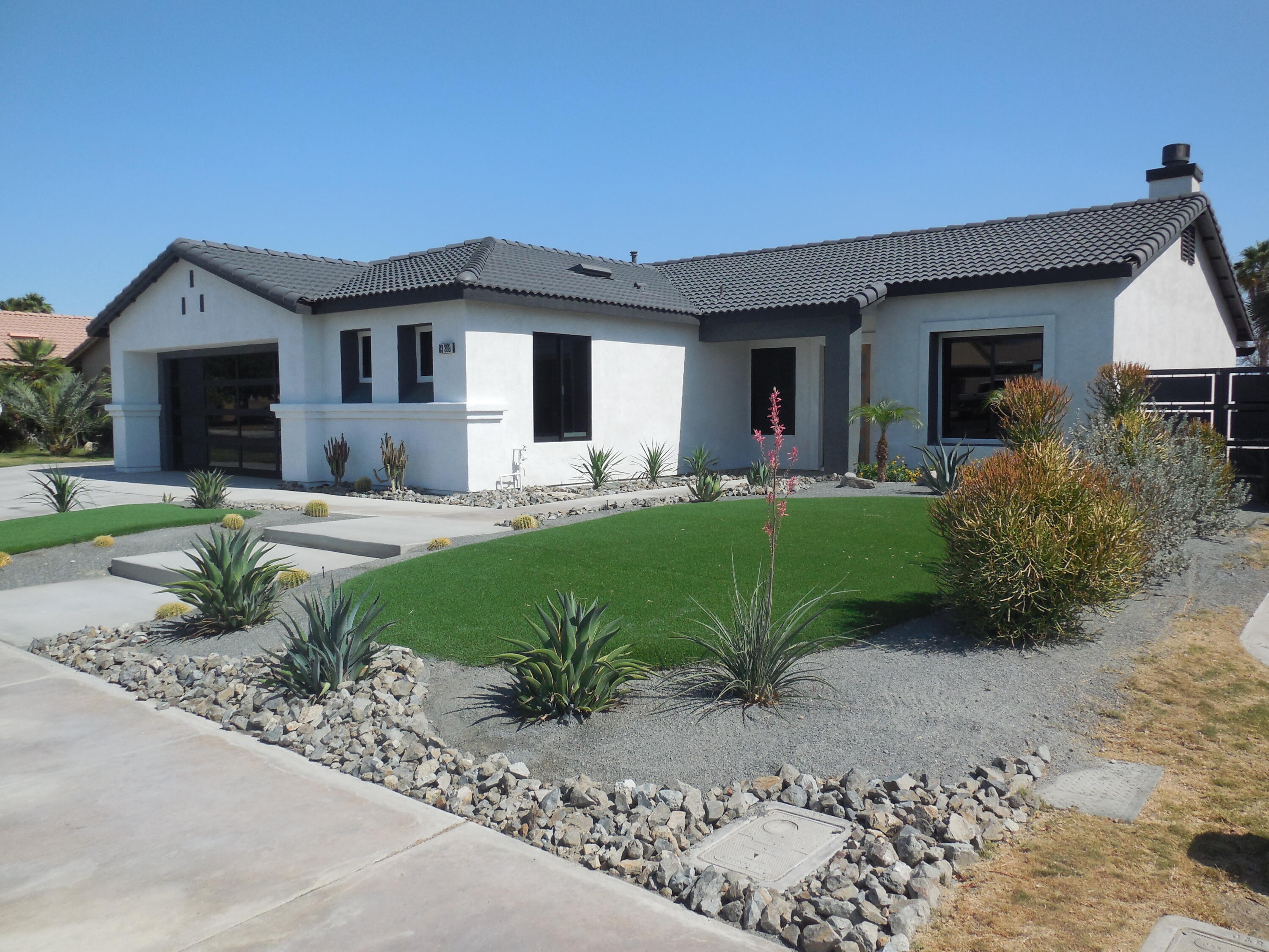 83389 Calypso Circle Indio, CA 92201 - Photo 2 of 45 a view of a house with backyard and sitting area