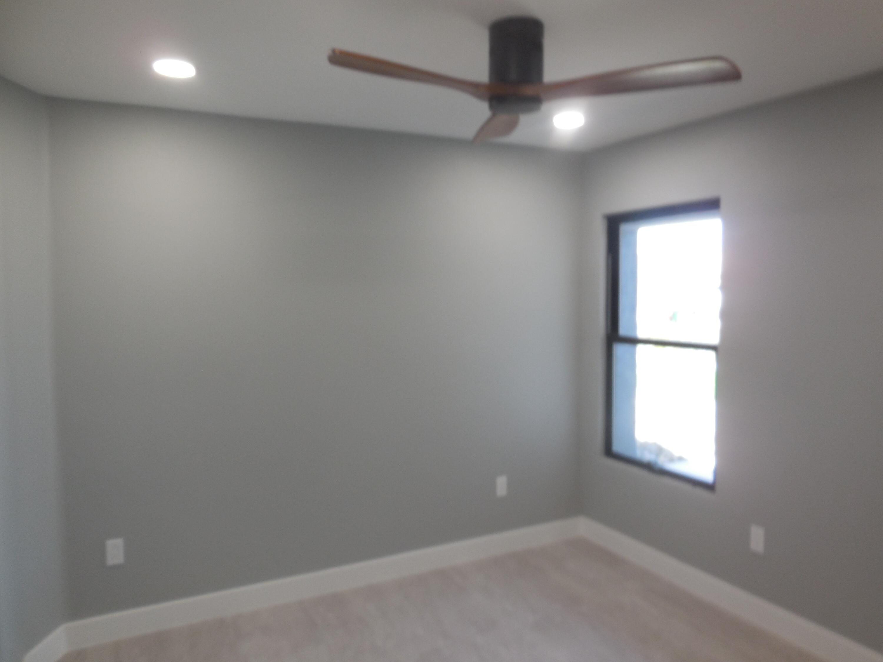 83389 Calypso Circle Indio, CA 92201 - Photo 22 of 45 an empty room with a window and a ceiling fan