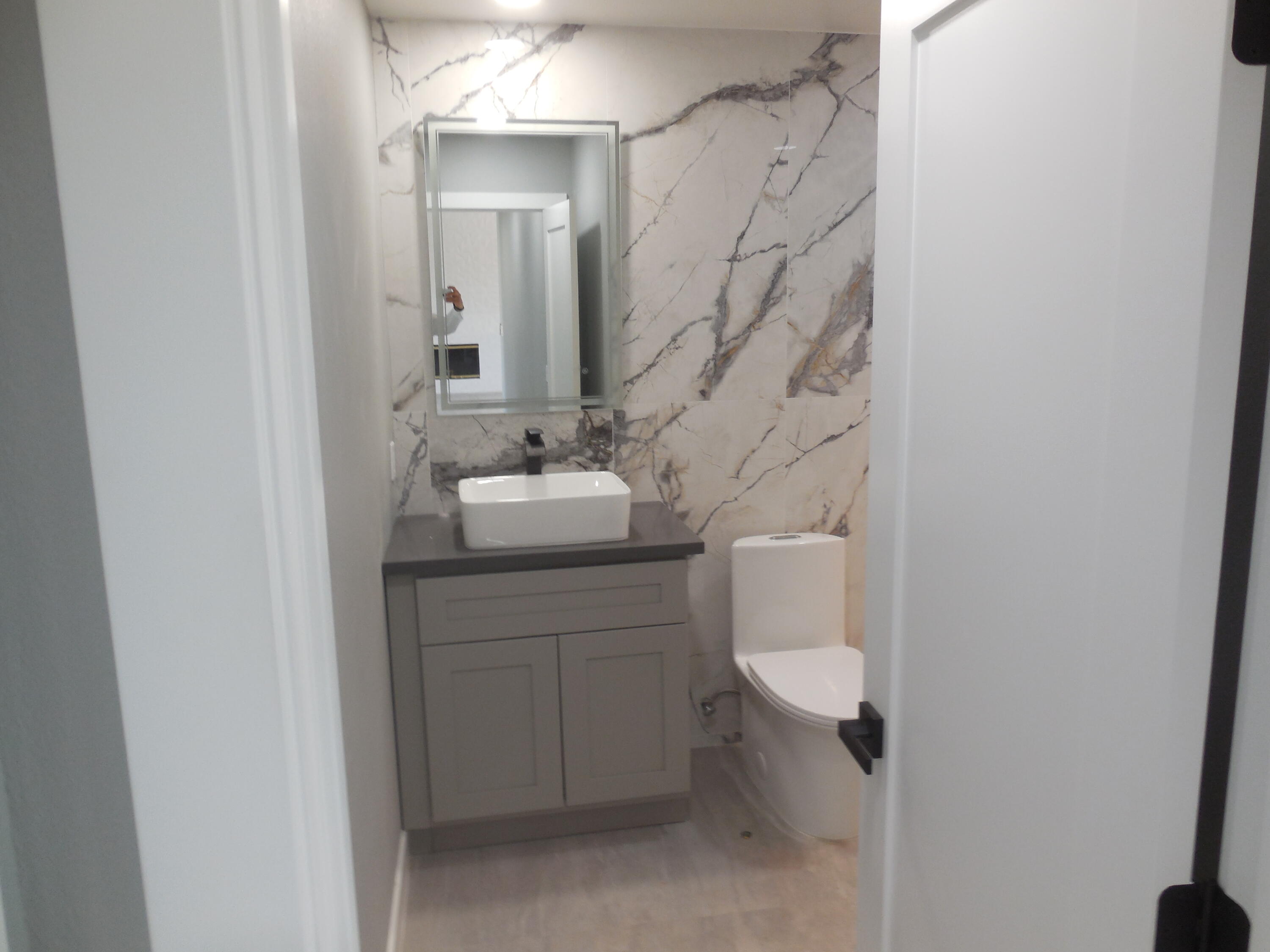 83389 Calypso Circle Indio, CA 92201 - Photo 25 of 45 a bathroom with a sink a toilet and a mirror