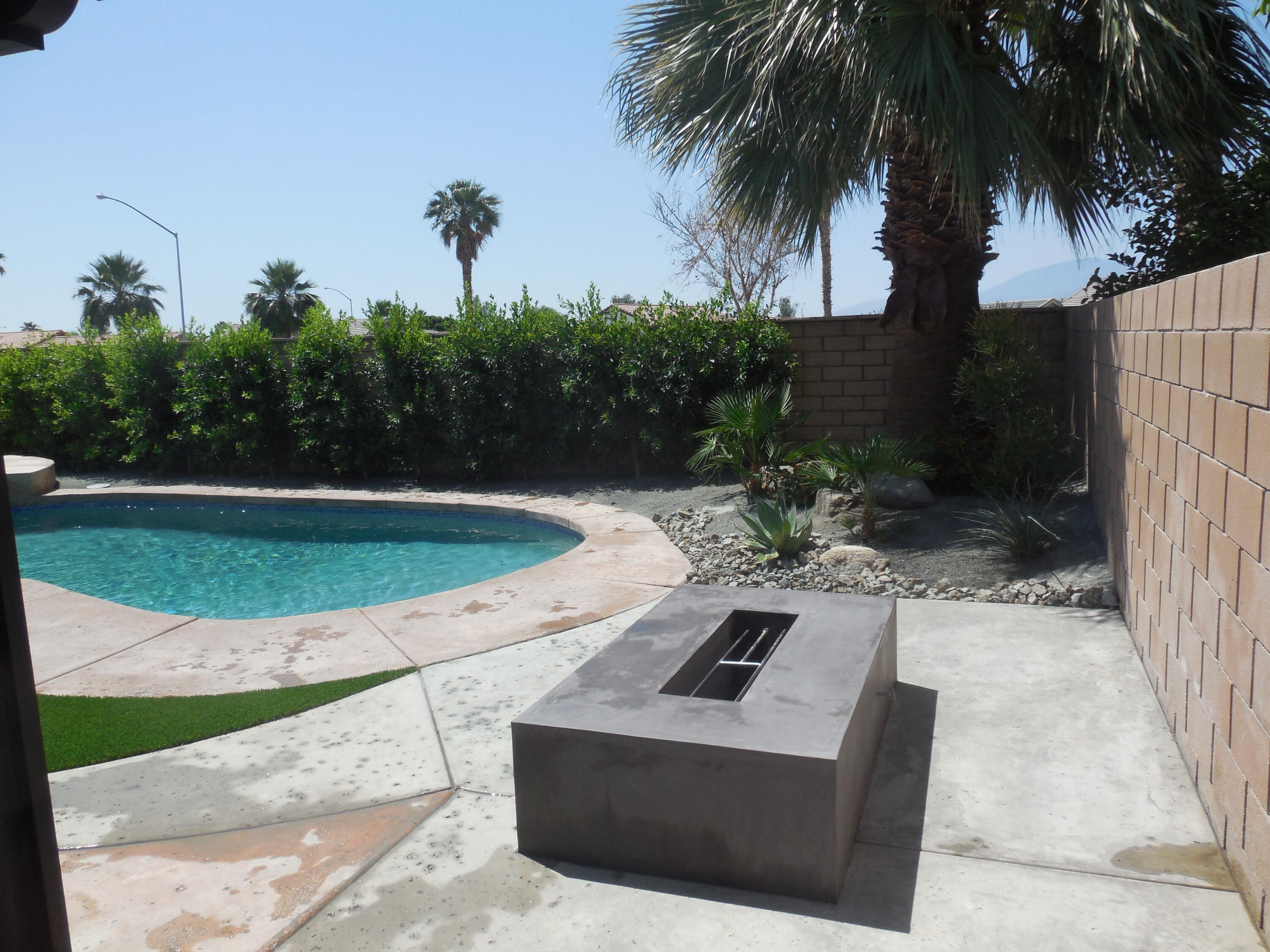 83389 Calypso Circle Indio, CA 92201 - Photo 32 of 45 a view of a backyard with a tub