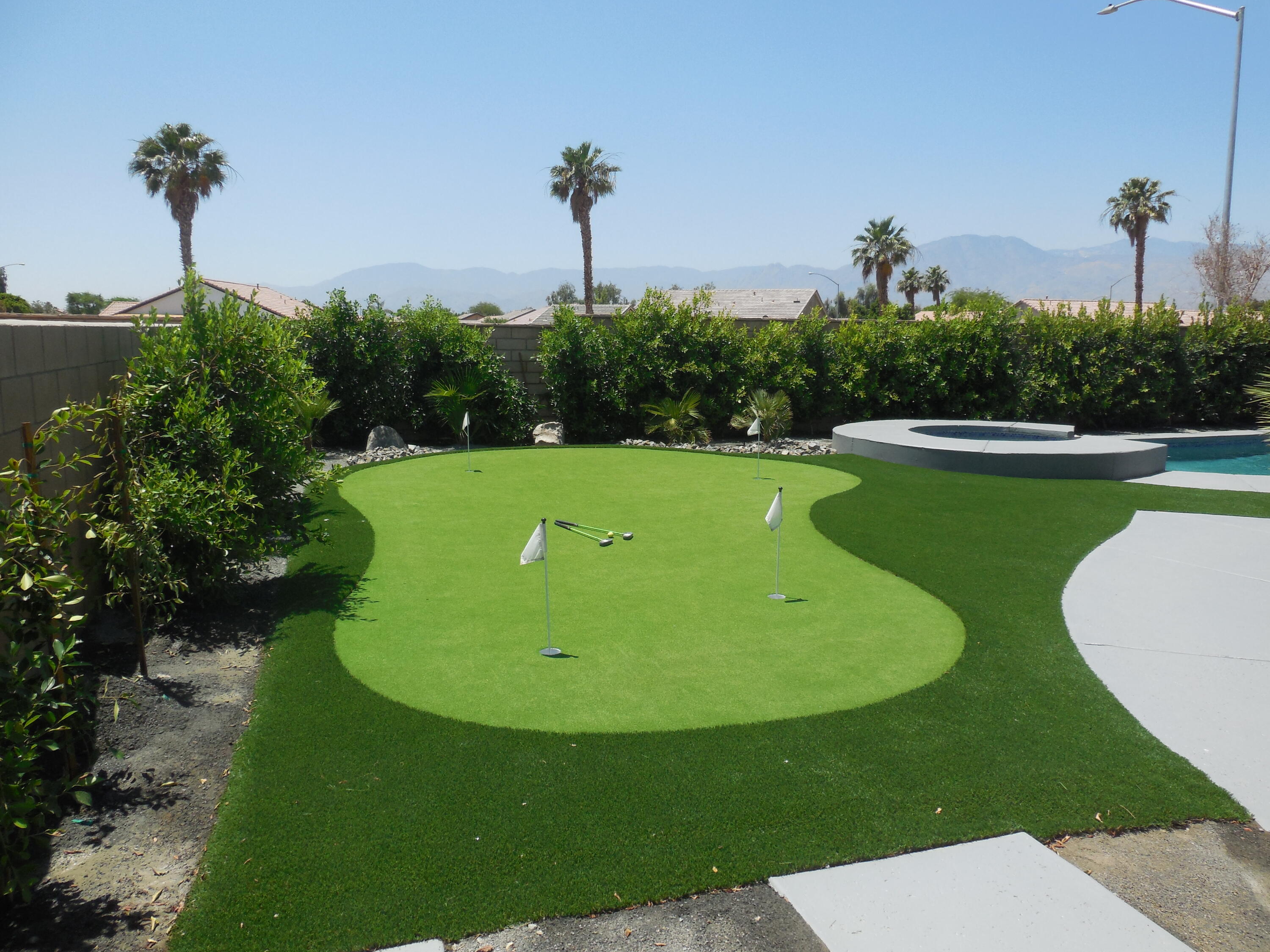 83389 Calypso Circle Indio, CA 92201 - Photo 40 of 45 a view of a swimming pool with a yard and plants