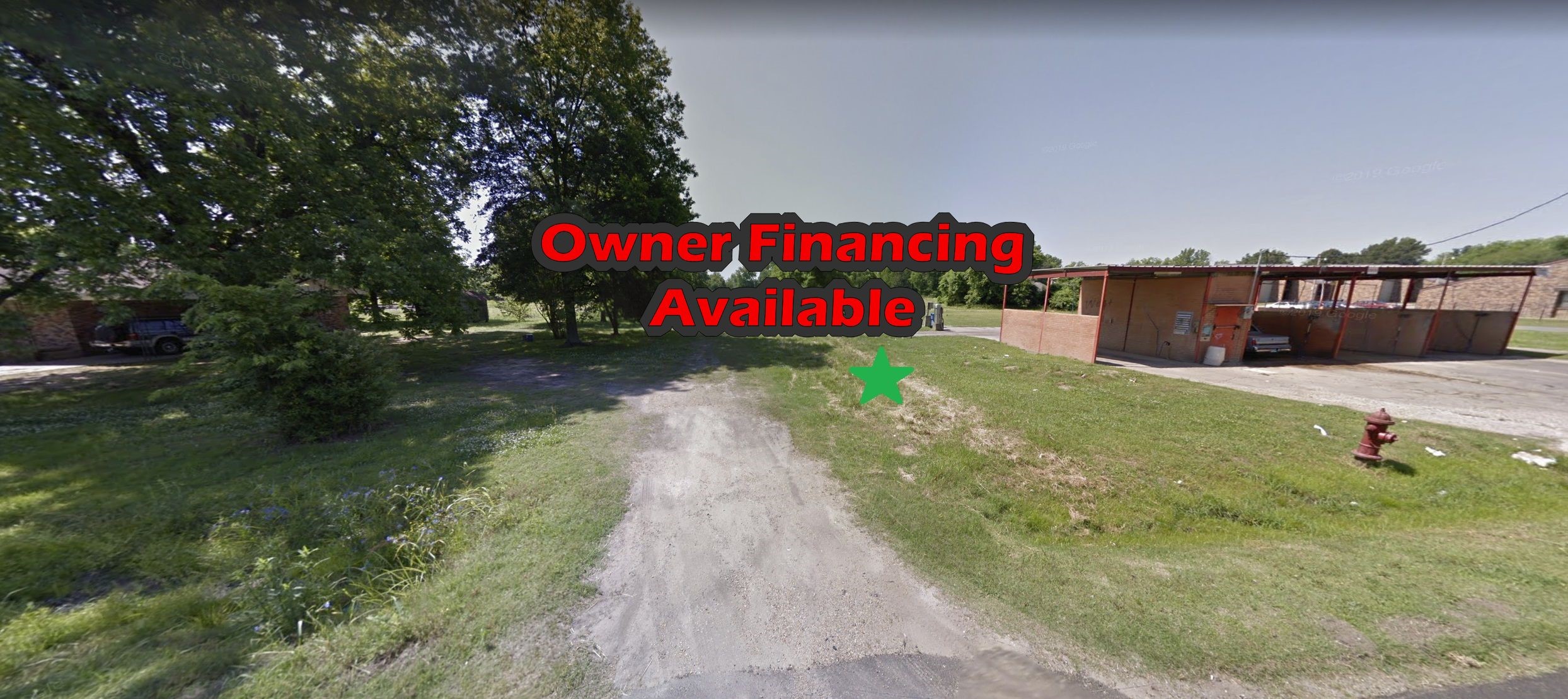 a street view with a play ground in the back