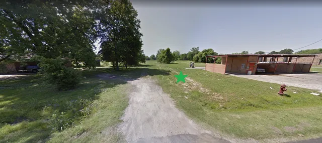 a swimming pool with outdoor seating and yard