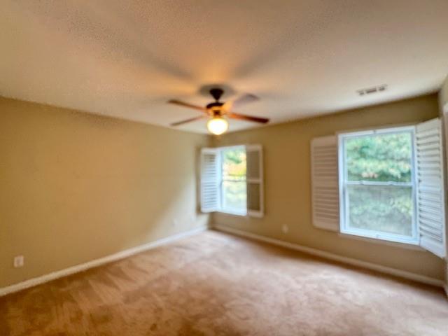419 Grayson Way Alpharetta, GA 30004 - Photo 11 of 16 a view of a livingroom with a ceiling fan and window