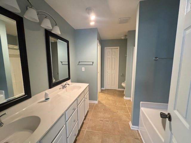 419 Grayson Way Alpharetta, GA 30004 - Photo 15 of 16 a bathroom with a tub sink and mirror