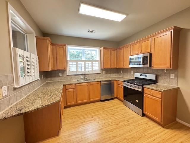 419 Grayson Way Alpharetta, GA 30004 - Photo 8 of 16 a kitchen with stainless steel appliances granite countertop a stove a sink dishwasher and a microwave oven with cabinets