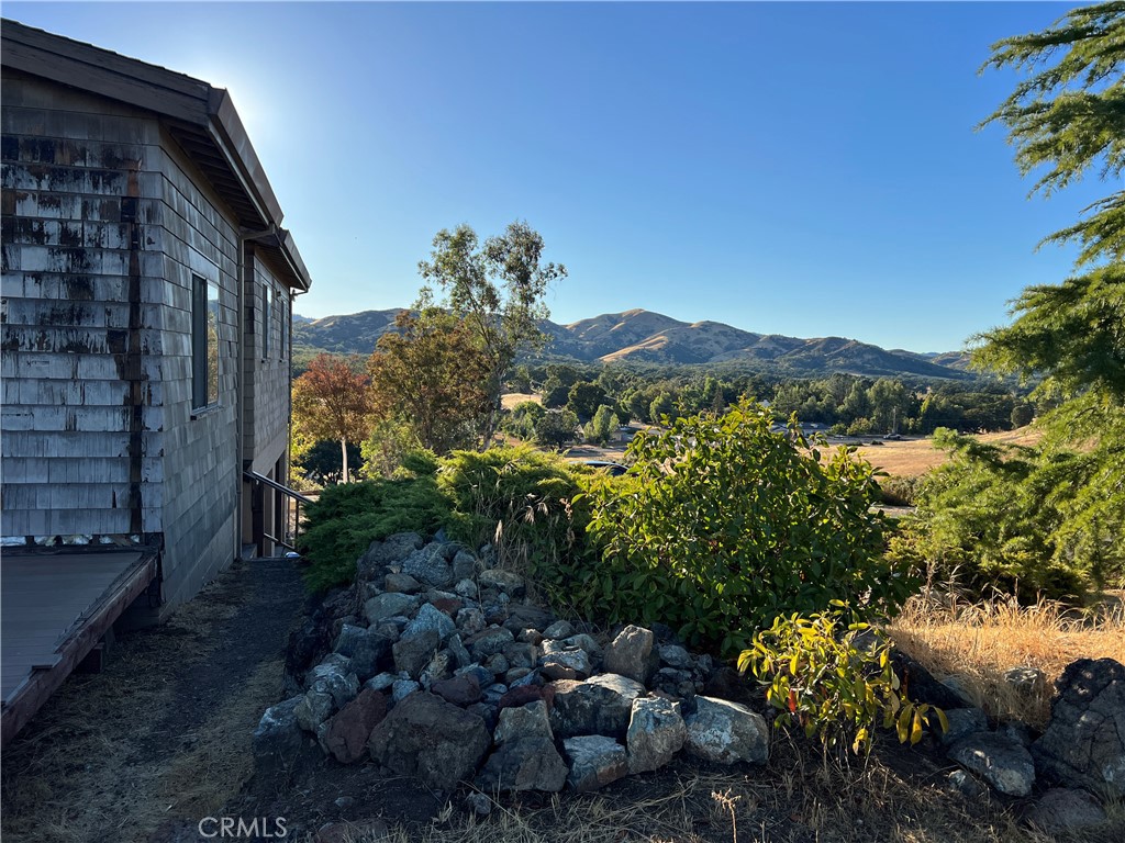 3245 Ackley Road Lakeport, CA 95453 - Photo 1 of 16 a view of a house with a yard and sitting area