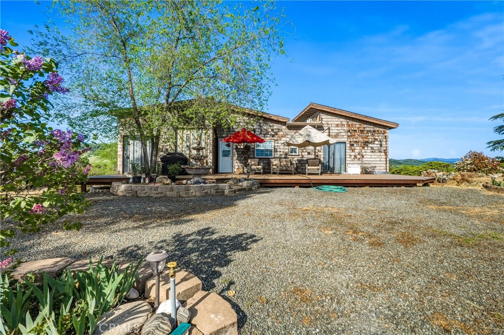 3245 Ackley Road Lakeport, CA 95453 - Photo 11 of 16 a view of a house with a yard