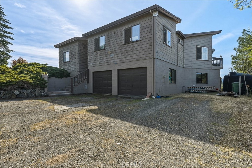 3245 Ackley Road Lakeport, CA 95453 - Photo 14 of 16 a front view of a house with a yard