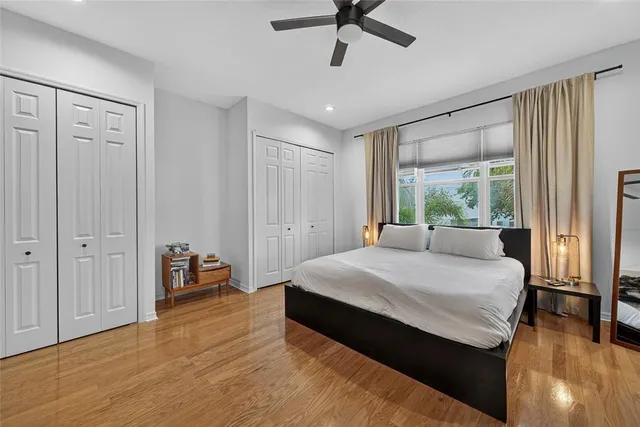 a room with a bed and large window