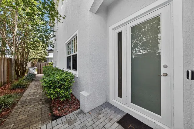 a view of a front door and wooden floor