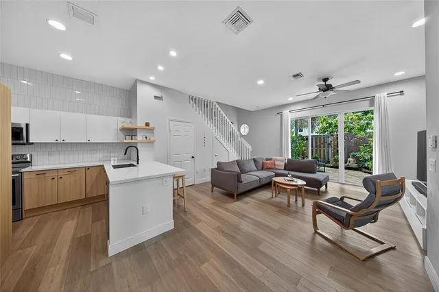 a living room with furniture and a large window