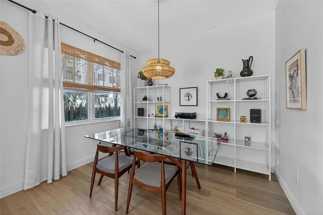 a dining room with furniture and window
