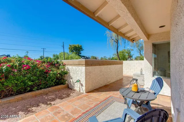 a view of a backyard with a patio