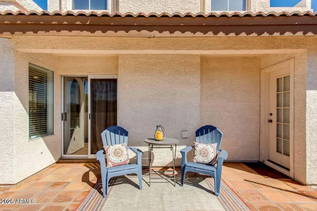a view of a swimming pool with a patio