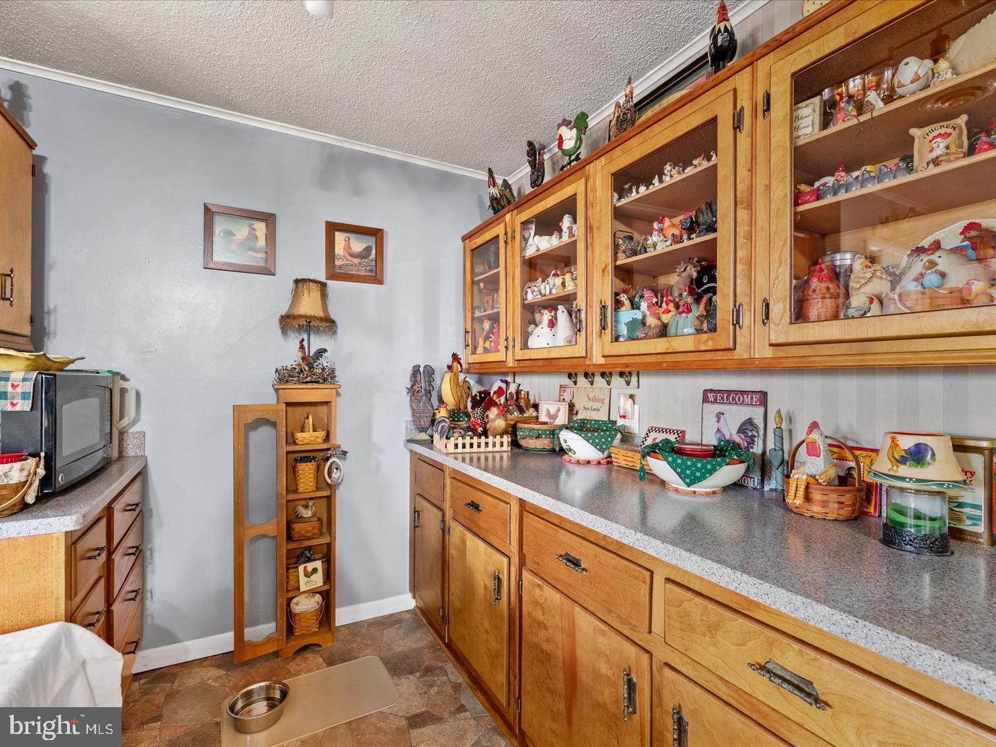 7132 Airport Road Laurel, DE 19956 - Photo 23 of 37 a kitchen with stainless steel appliances granite countertop a sink and cabinets