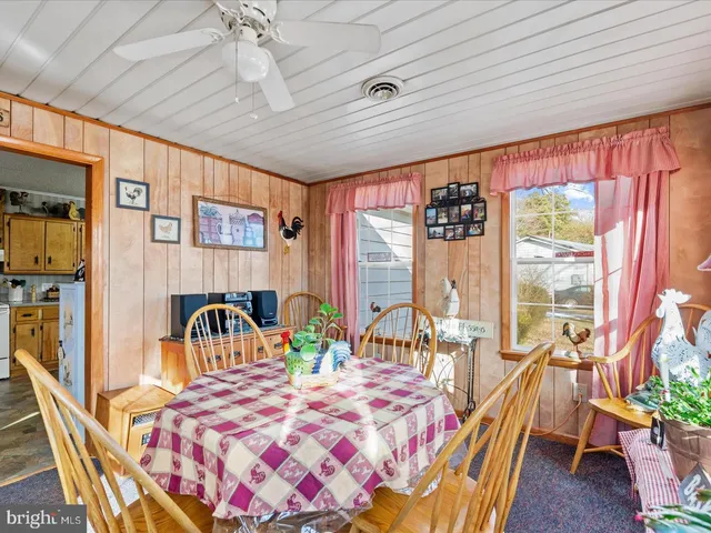 a bedroom with furniture and a large window