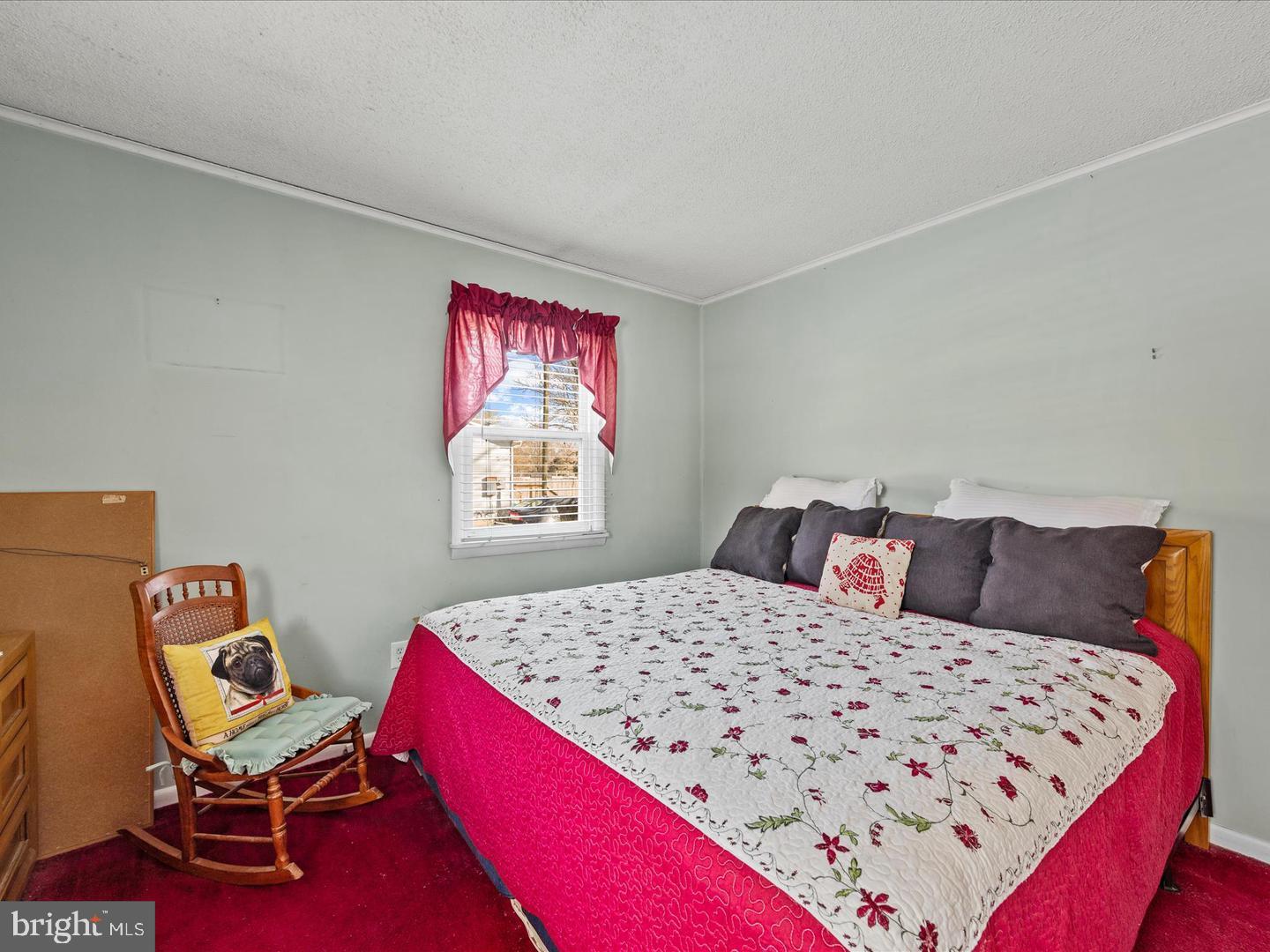7132 Airport Road Laurel, DE 19956 - Photo 32 of 37 a bed room with a bed and chair