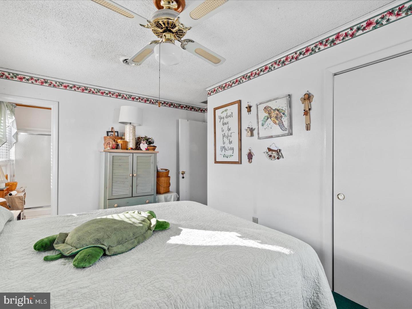 7132 Airport Road Laurel, DE 19956 - Photo 36 of 37 a bedroom with a bed and a chandelier
