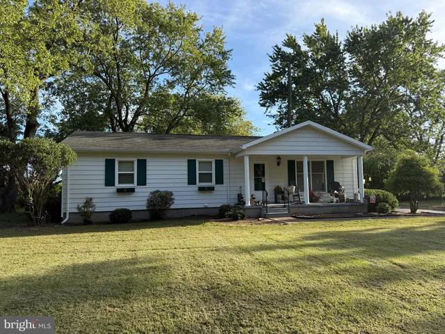 a front view of house with yard and seating area