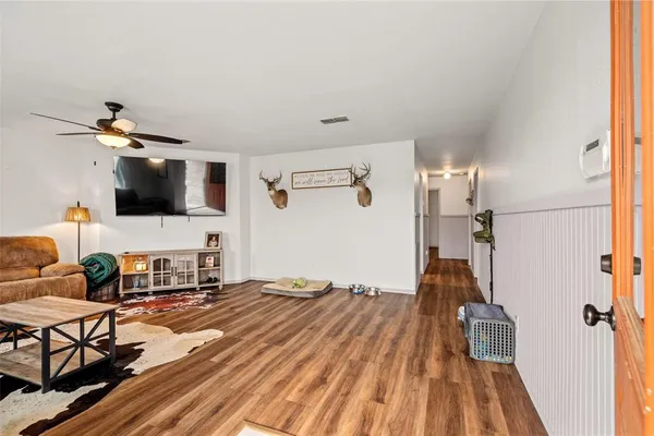 a living room with a flat screen tv and a couch