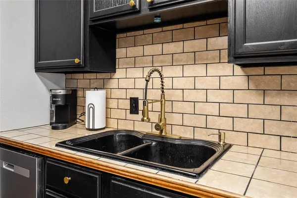 a kitchen with a refrigerator sink and stove