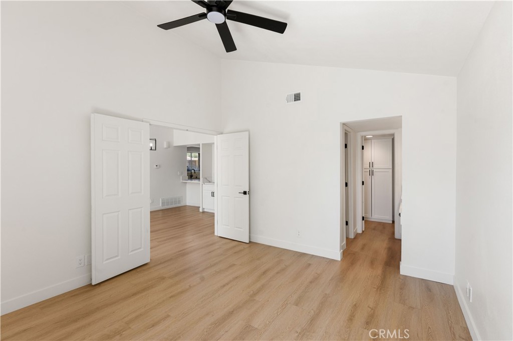 82151 Waring Way Indio, CA 92201 - Photo 11 of 22 a view of a room with wooden floor and white walls