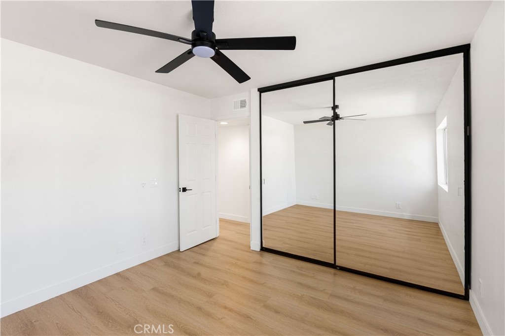 82151 Waring Way Indio, CA 92201 - Photo 18 of 22 a view of empty room with wooden floor