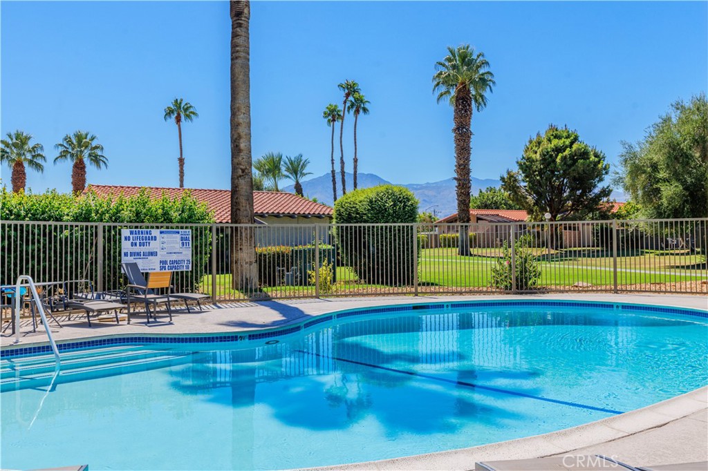 82151 Waring Way Indio, CA 92201 - Photo 22 of 22 a view of a swimming pool with a lounge chairs