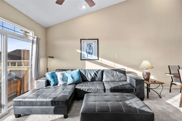 a bedroom with a bed and glass window