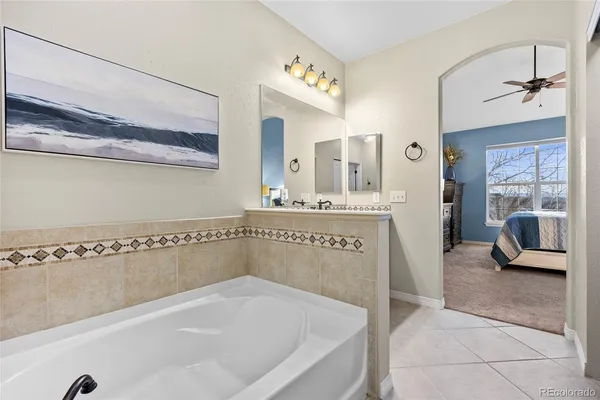 a bedroom with bed and a window