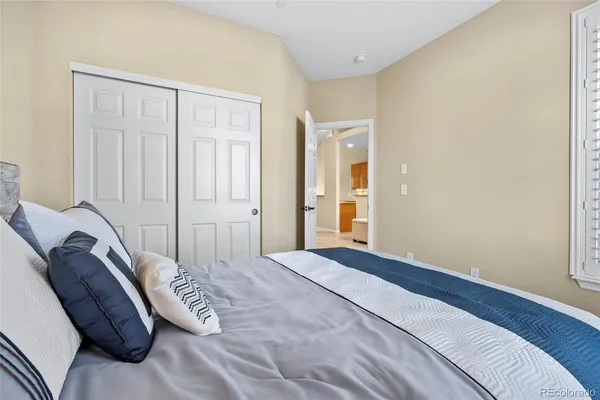 a utility room with stainless steel appliances granite countertop a sink and cabinets