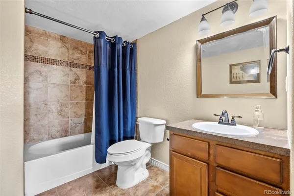 a bedroom with two beds and a table