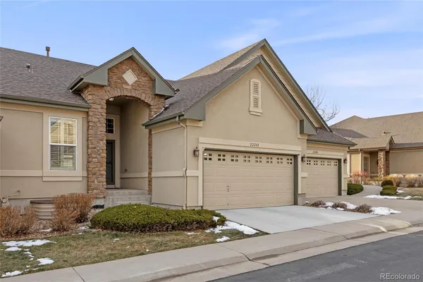 a front view of a house with garage