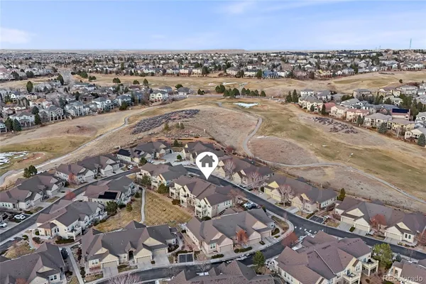 a view of house with outdoor space and sitting area