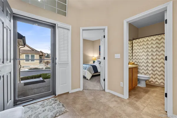 a view of a bedroom from a corridor