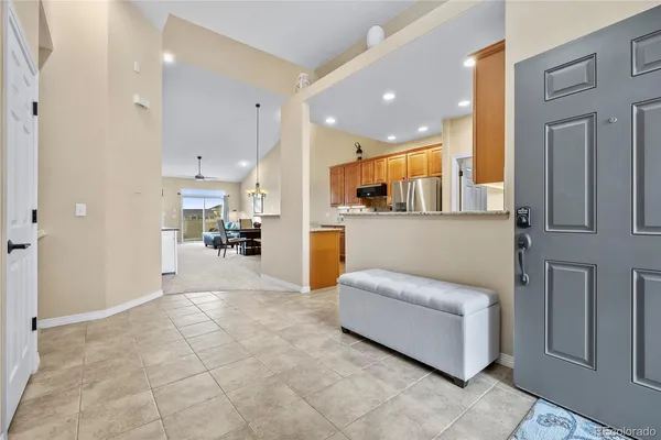 a view of living room kitchen with furniture and wooden floor