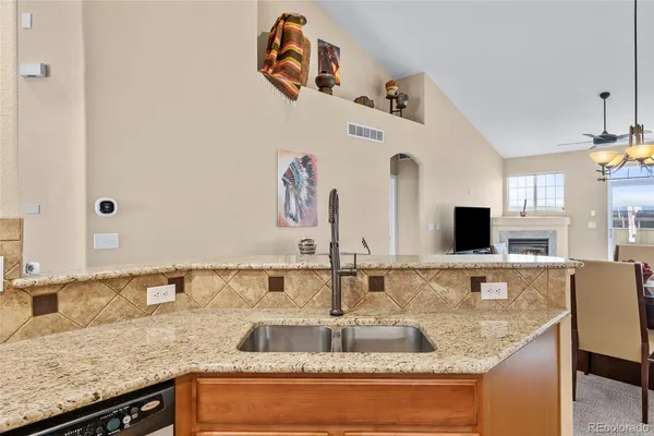 a kitchen with granite countertop a sink and a granite counter tops
