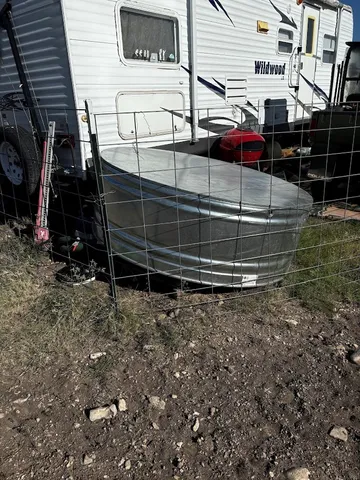 a front view of a house with garden space and sitting space
