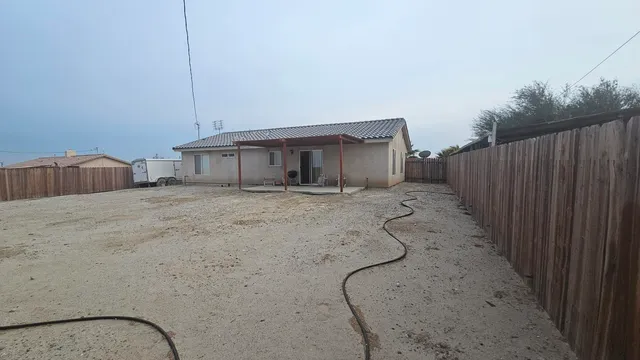 a view of a room with wooden walls