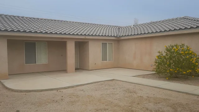 an empty room with a fireplace