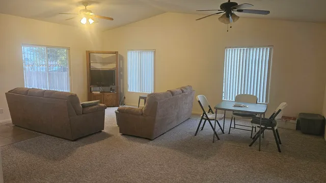 a living room with furniture and a window