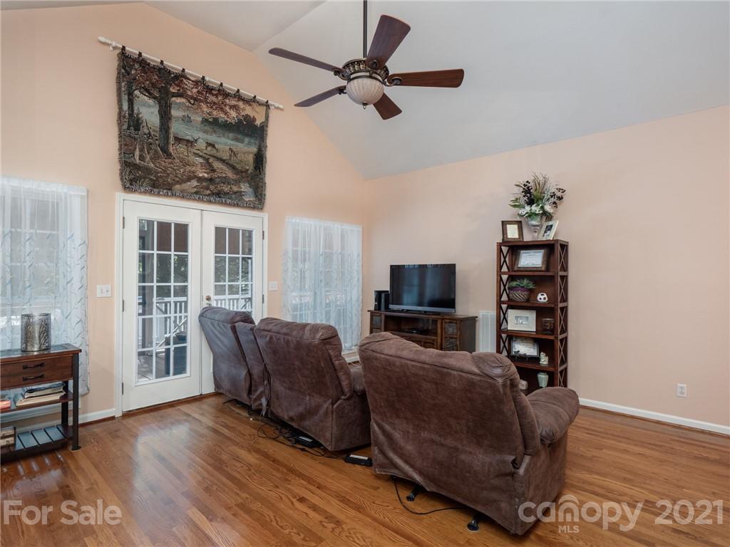 9141 Sunrise Meadow Road Fort Mill, SC 29715 - Photo 14 of 45 a living room with furniture a flat screen tv and a window