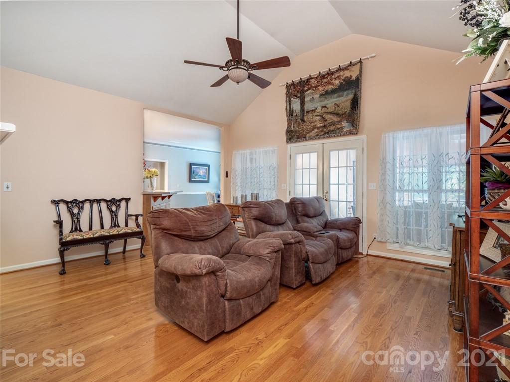9141 Sunrise Meadow Road Fort Mill, SC 29715 - Photo 16 of 45 a living room with furniture and a wooden floor