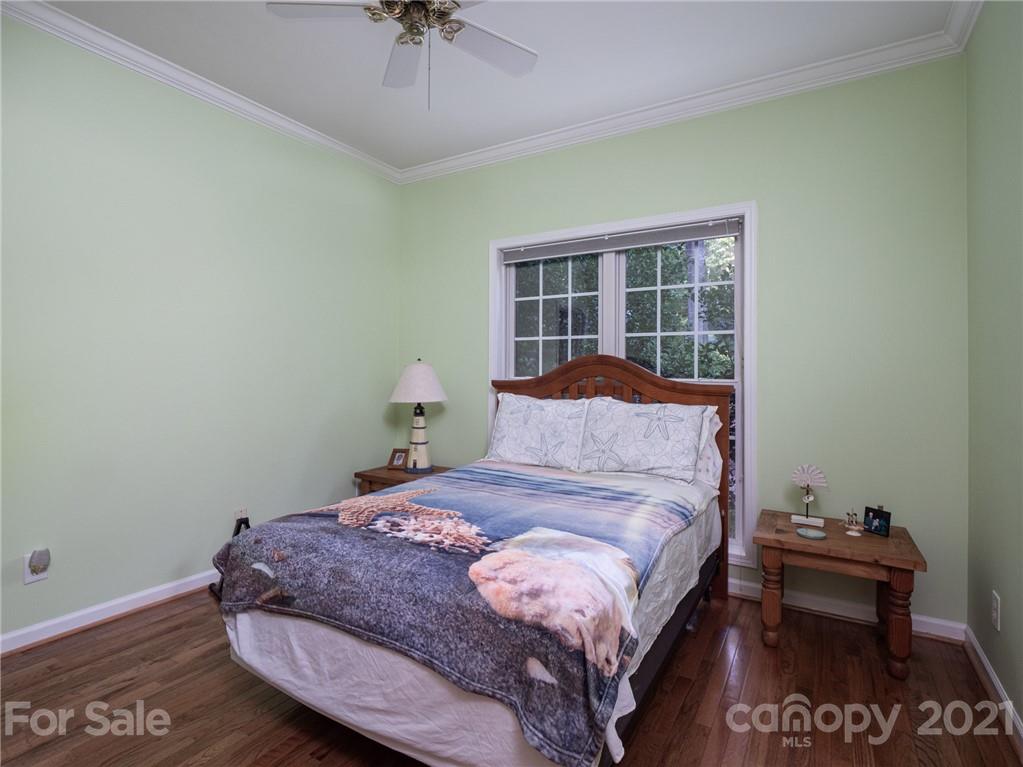 9141 Sunrise Meadow Road Fort Mill, SC 29715 - Photo 27 of 45 a bedroom with a bed and a table in it