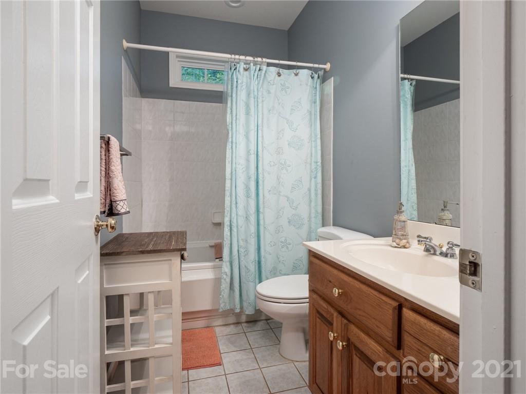 9141 Sunrise Meadow Road Fort Mill, SC 29715 - Photo 29 of 45 a bathroom with a sink a toilet and shower
