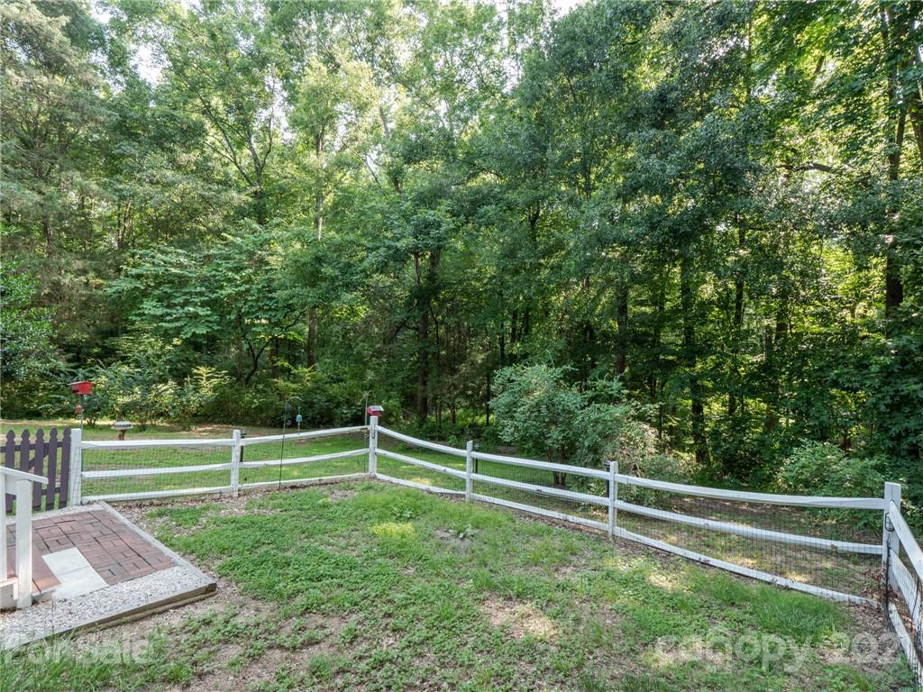 9141 Sunrise Meadow Road Fort Mill, SC 29715 - Photo 31 of 45 a view of a field with wooden fence