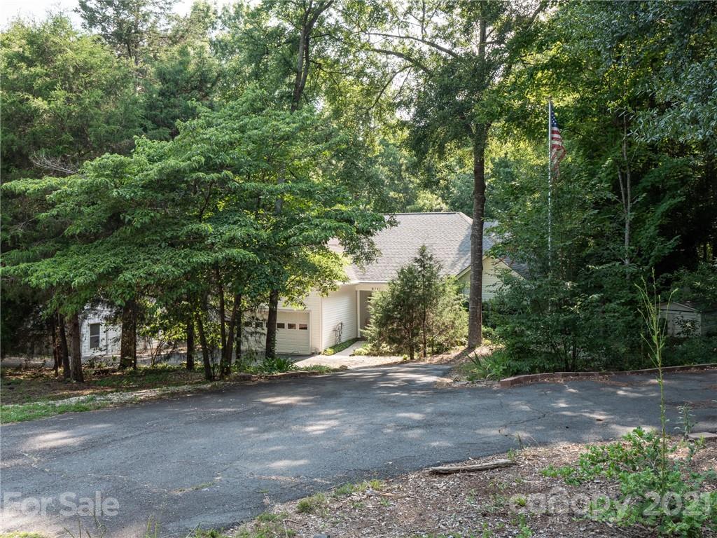 9141 Sunrise Meadow Road Fort Mill, SC 29715 - Photo 39 of 45 a view of a yard with plants and trees