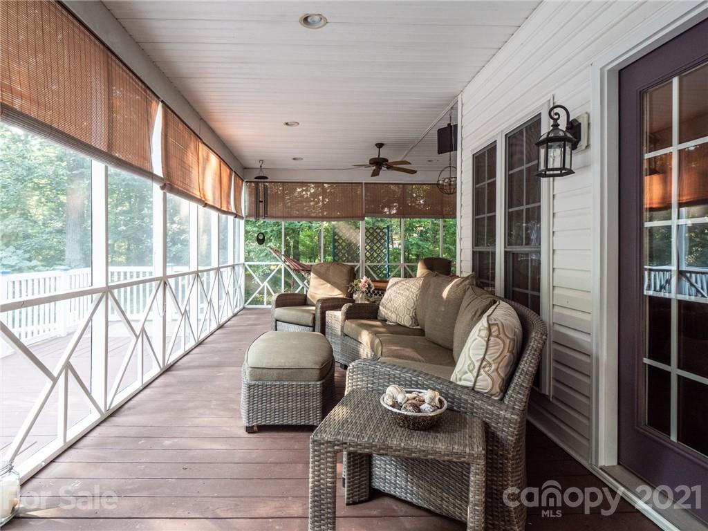 9141 Sunrise Meadow Road Fort Mill, SC 29715 - Photo 5 of 45 a living room with furniture and a floor to ceiling window